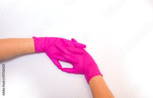 Female hand in a glove on a white background,