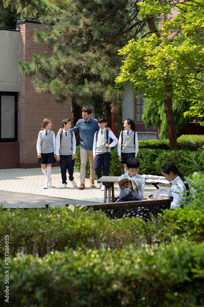 Teacher and students on campus