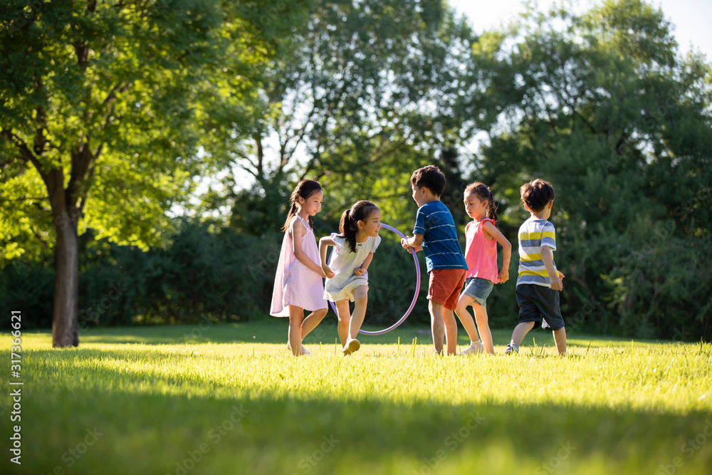 Happy children playing on meadow Happy children playing on meadow