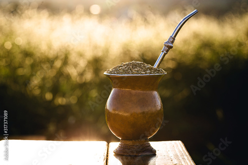 Chimarrão, or mate, is a characteristic drink of the culture of southern South America bequeathed by indigenous cultures. It consists of a gourd, a pump, ground yerba mate and warm water. photo