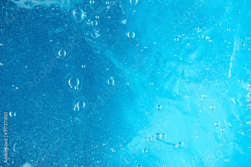 Underwater Near Ocean Surface with Rising Bubbles in Blue Sea