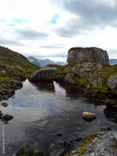 little lake with rocks at a mountain in Norway © Aleksander