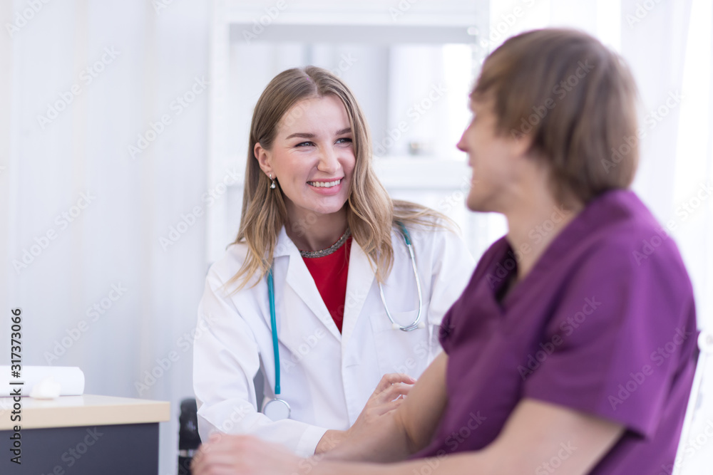 Portrait Of Female Doctor Wearing White Coat is Examining male Patient in the hospital. Portrait Of Female Doctor Wearing White Coat is Examining male Patient in the hospital.