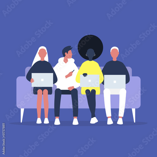 Coworking and coliving, a diverse group of millennials sitting on a sofa, friends and colleagues gathering together