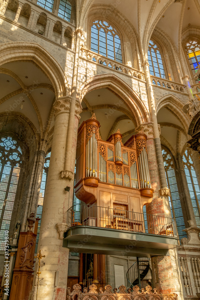 Beautiful interiors and pipe organ inside famous Saint Nicholas church, one of the oldest in Ghent, Belgium