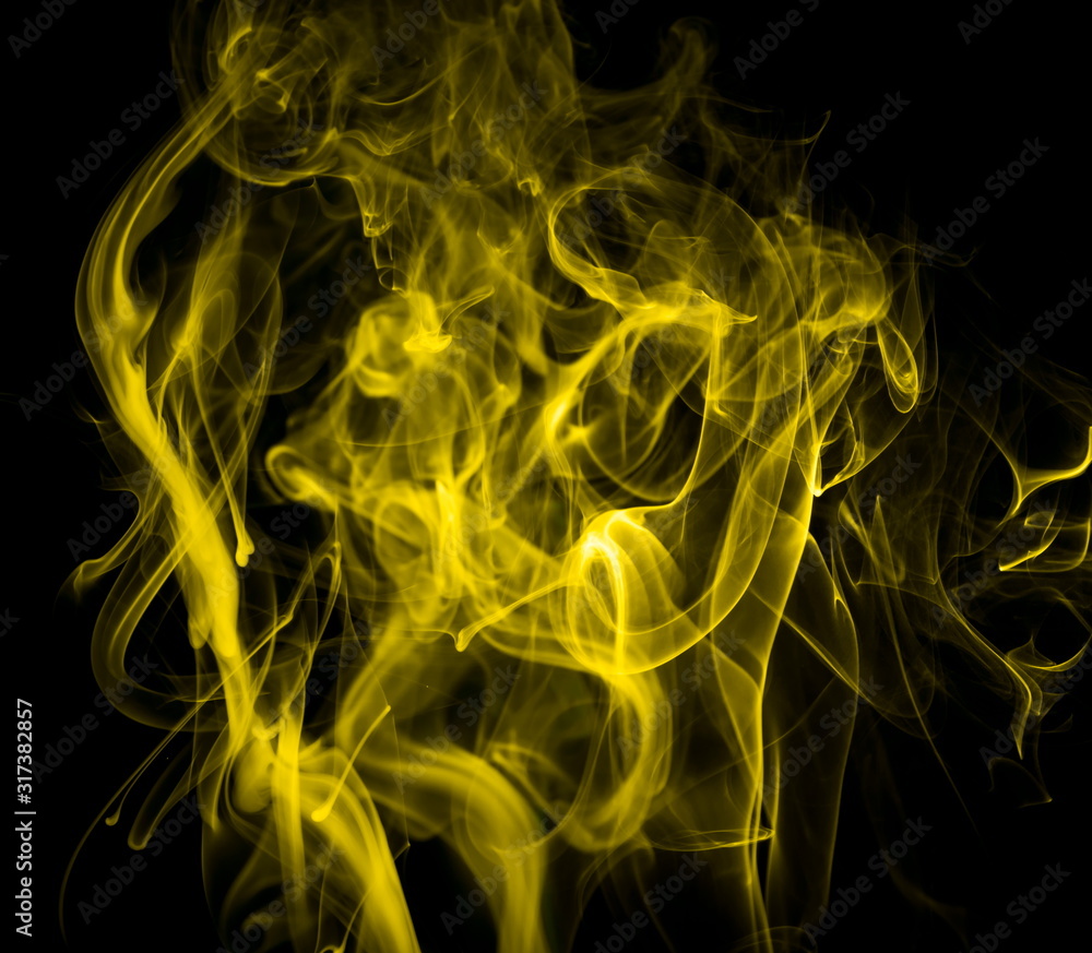 Yellow smoke on black background Yellow smoke on black background