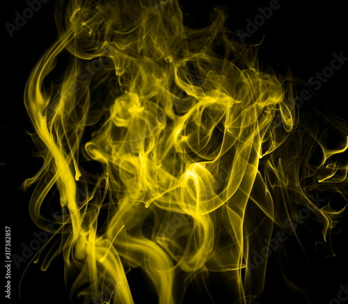 Yellow smoke on black background