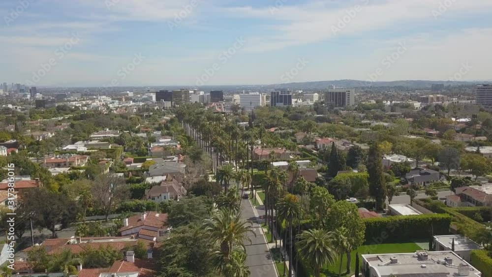 Birdseye Aerial Drone View of Downtown Beverly Hills California & Los Angeles Mountains on a Beautiful Sunny Afternoon Day Birdseye Aerial Drone View of Downtown Beverly Hills California & Los Angeles Mountains on a Beautiful Sunny Afternoon Day