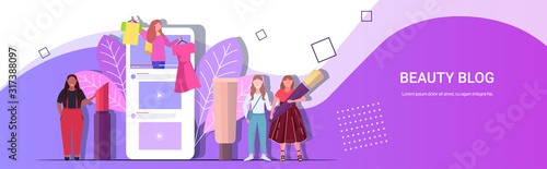 fashion beauty bloggers showing clothes and latest trend makeup tutorials mix race women recording online video live streaming blogging concept smartphone screen mobile app horizontal copy space