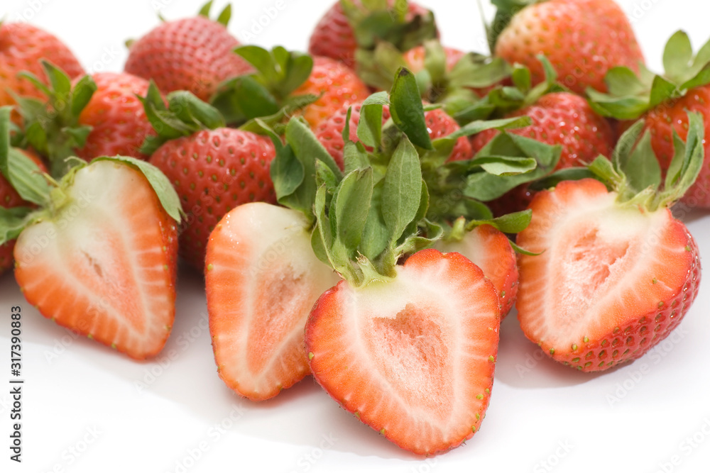 pile of strawberries whole and halves pile of strawberries whole and halves