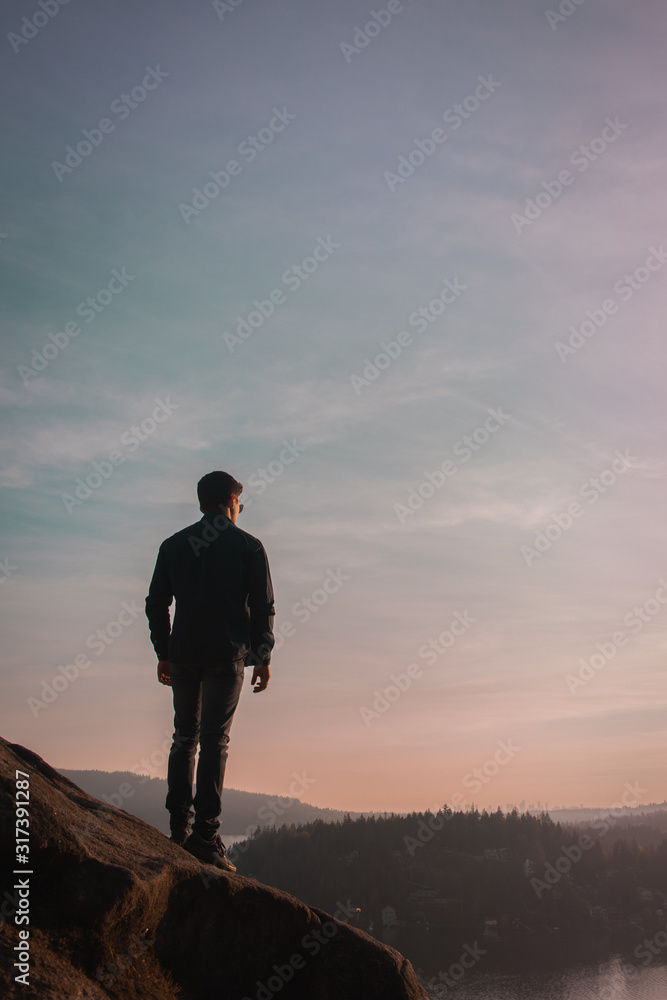 man on top of mountain