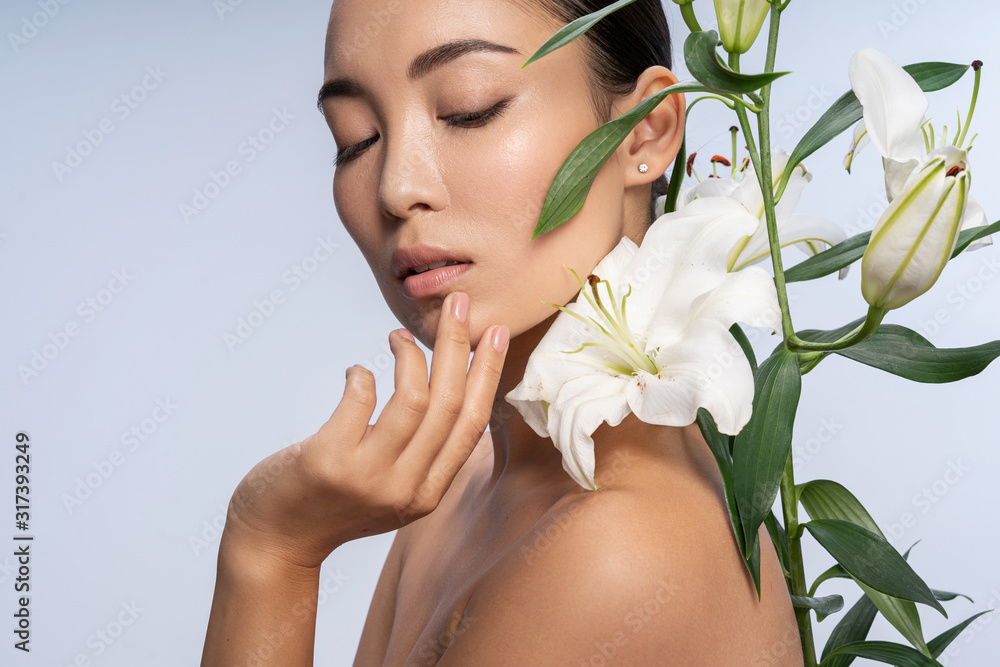 Beautiful girl posing with beautiful bouquet in studio Beautiful girl posing with beautiful bouquet in studio
