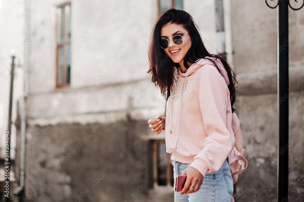 Beautiful model posing for the camera on the streets.