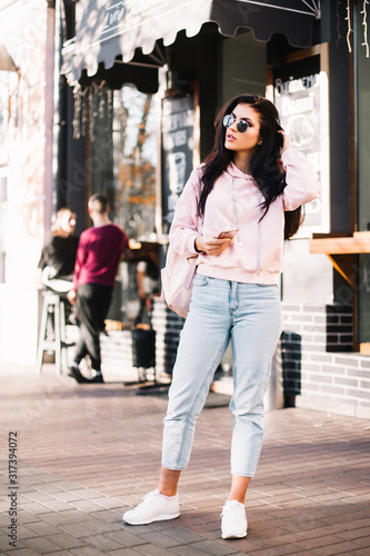 Beautiful model posing for the camera on the streets.