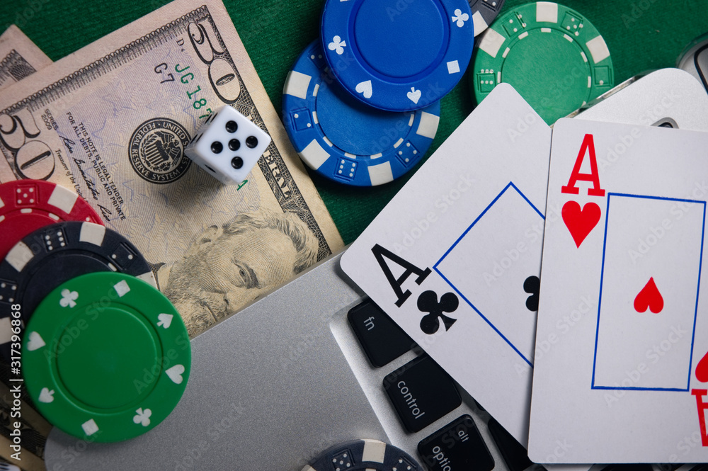 Online casino, poker. Background for business online games, poker,  blackjack game. Online card games. Laptop, money and chips. Stock Photo |  Adobe Stock