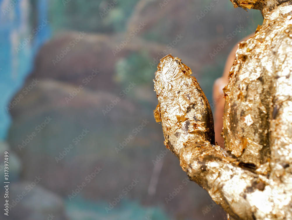 Fototapeta premium Close up praying hands of Buddha. Praying hands golden of Buddha.