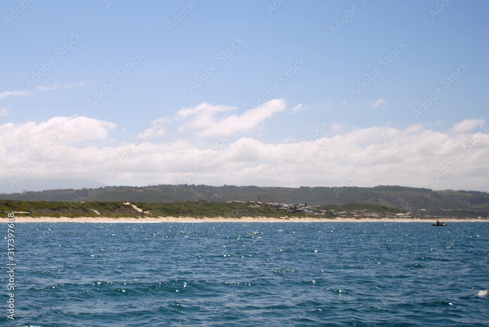 View of the shoreline from a boat in the bay, Mosselbaai (Mossel Bay) South Africa, February 2012.