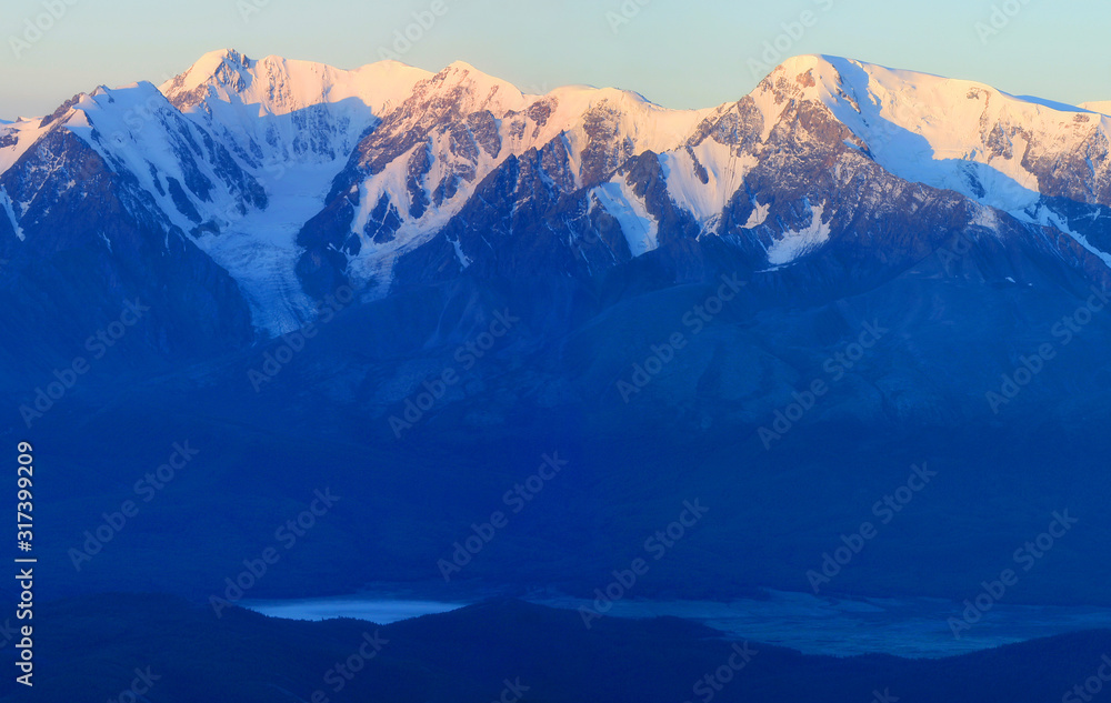 The ridge at dawn, blue natural background, Altay The ridge at dawn, blue natural background, Altay
