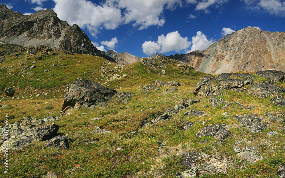 Mountain tundra, rocks, beautiful sky Mountain tundra, rocks, beautiful sky