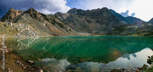 Wild mountain lake in the Altai mountains, summer landscape, reflection