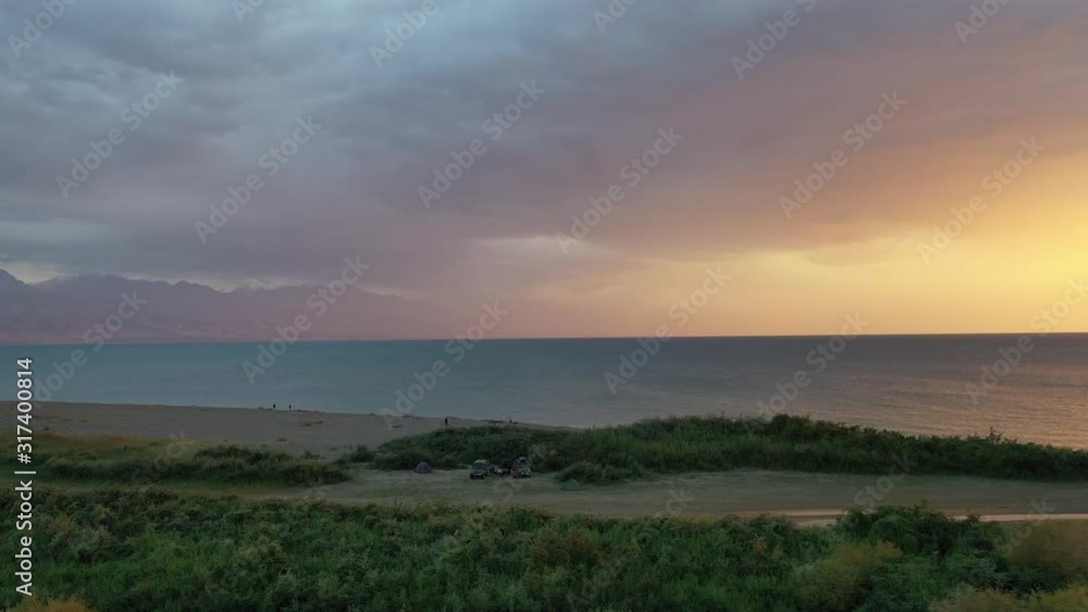 Wild beach on the shore of lake Issyk Kul 1607 m. Kyrgyzstan Wild beach on the shore of lake Issyk Kul 1607 m. Kyrgyzstan