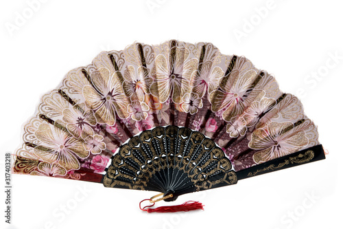 Flamenco hand fan with colorful pattern isolated on white background. Spanish or Chinese influence