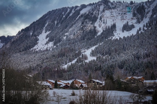 The beautiful mountain cottages in Thollon Les Memises, France in Winter photo