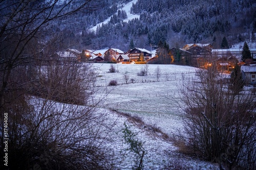 The beautiful mountain cottages in Thollon Les Memises, France in Winter photo