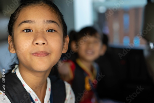 Portrait Asian child girl Take the car to school happy smile