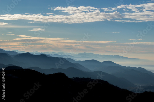 Layers of mountains in sunrise seen from the top of Mussoorie  Uttarakhand  India