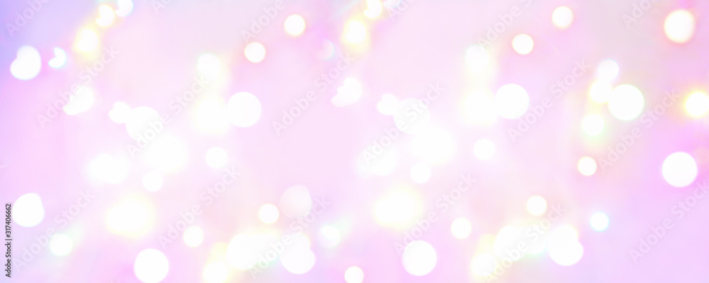 Banner. Abstract background of glowing balls of lights on a soft pink background. Horizontal blurred background