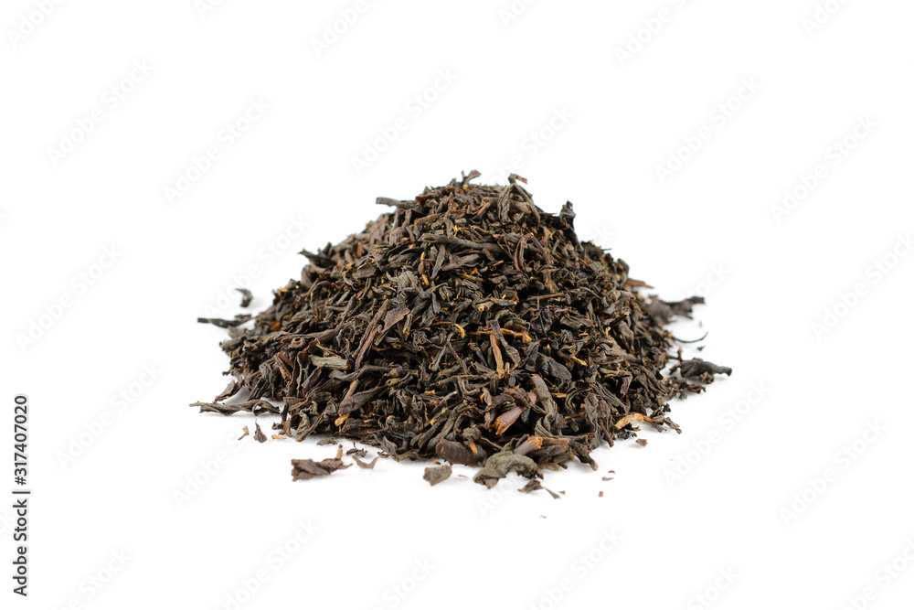 Pile of dry black tea leaves on a white background close-up. Pile of dry black tea leaves on a white background close-up.
