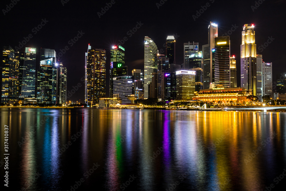City at night near Merlion park, It is a famous tourist attraction in Singapore.