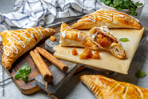 Puff pastry apple pastry turnovers for dessert. photo