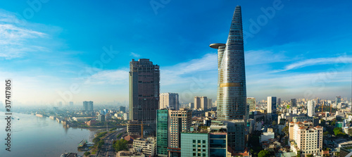 Ho Chi Minh (Saigon) City, Vietnam - CIRCA 2019: Saigon aerial cityscape, showing Saigon River on the left and Bitexco Financial Tower on the right. photo