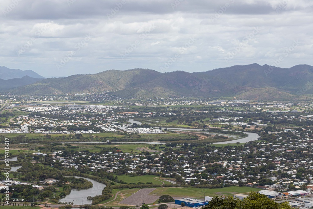 City seen from the top of the lookout with a crystal clear sea and the city in a perfect square with lots of vegetation and mountains. Townsview City seen from the top of the lookout with a crystal clear sea and the city in a perfect square with lots of vegetation and mountains. Townsview