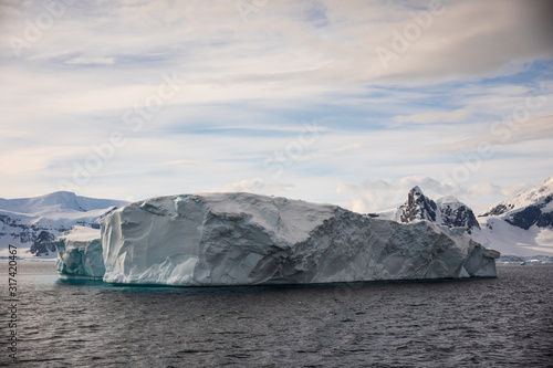 Large iceberg floating in the cold water of Antarctica
