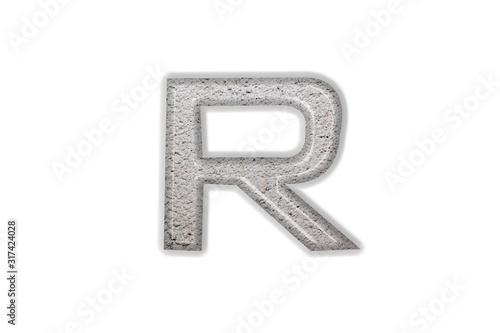 The English letter " R " is made of concrete
