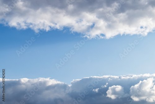 Fototapeta Naklejka Na Ścianę i Meble -  Blue sky with white clouds. Central area to write. 