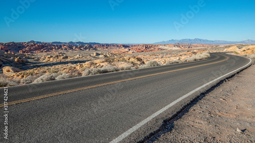 USA, Nevada, Clark County, Valley of Fire State Park. the scenic drive road twists around a series of bends at the Rainbow Vista overlook.