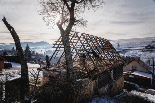 Pokryvac, Slovakia, January 2, 2020. Disassembling old wooden cottage, Orava wooden cottage. photo