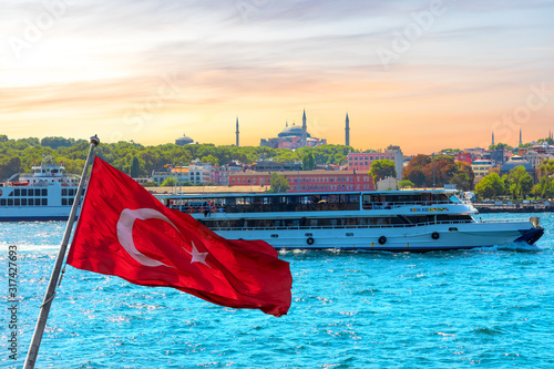 Photography Turkish flag, the ship in the Bosporus and Hagia Sophia in the background, Istan