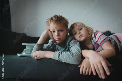 kids sad and tired of homework, boy and girl stressed and exhausted