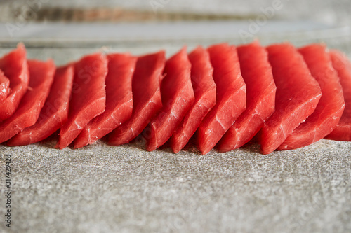 Sliced tuna with sashimi knife 