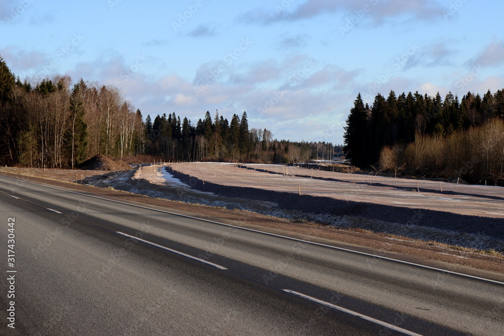 Fototapeta premium Road Construction . Limestone Gravel layer on the top. Sand foundation layer 