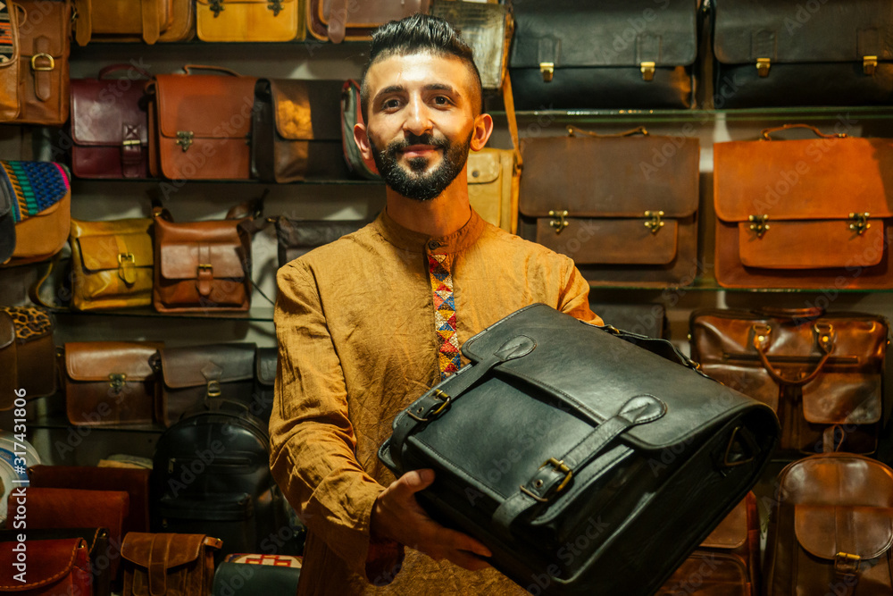 egypt sallerman showing his bags at arambol goa market Stock-Foto | Adobe  Stock