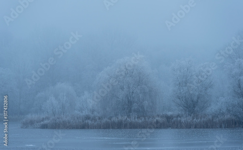 Frosty landscape a winters day © SasaStock