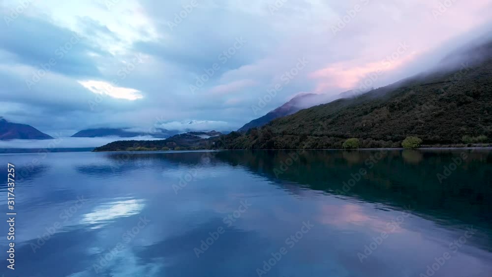 mirror lake with low hanging clouds during sunrise mirror lake with low hanging clouds during sunrise