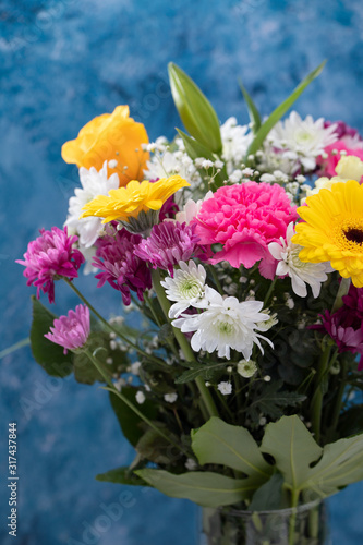 bouquet of beautiful flowers with blue background
