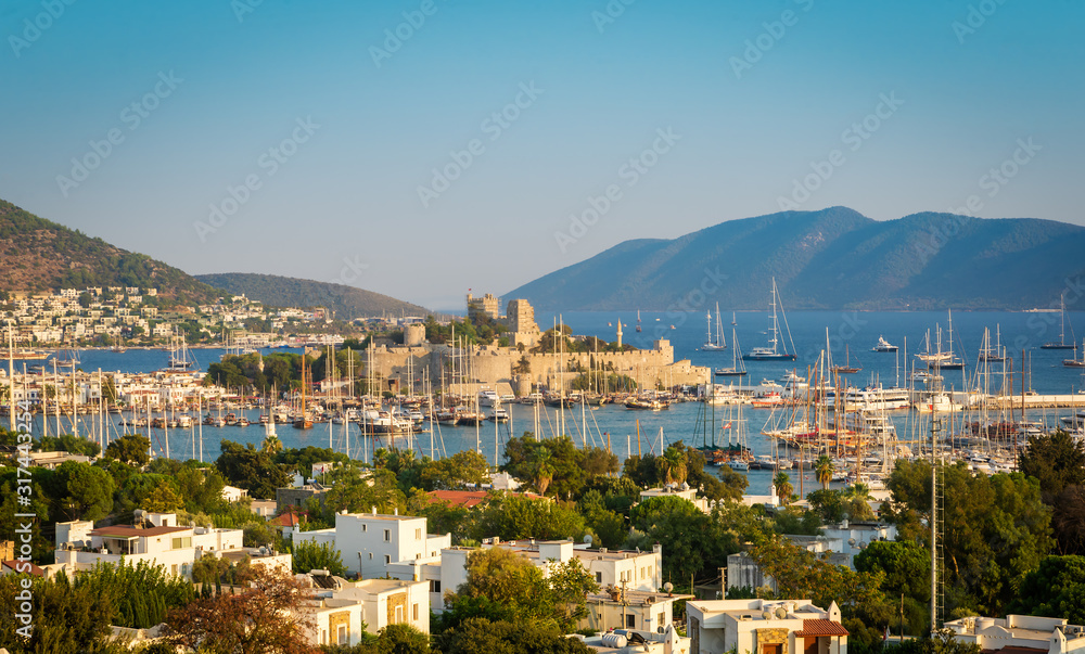 Panoramic view of Saint Peter Castle and marina, Bodrum, Turkey at sunset